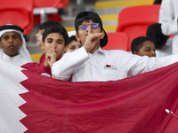 Qatar team supporters cheer for their team during the qualification 3rd round for the FIFA World Cup 2026 group A match between Qatar and Un...