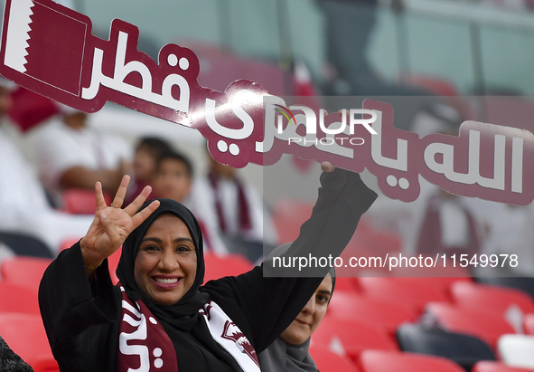 Qatar team supporters cheer for their team during the qualification 3rd round for the FIFA World Cup 2026 group A match between Qatar and Un...