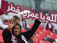 Qatar team supporters cheer for their team during the qualification 3rd round for the FIFA World Cup 2026 group A match between Qatar and Un...