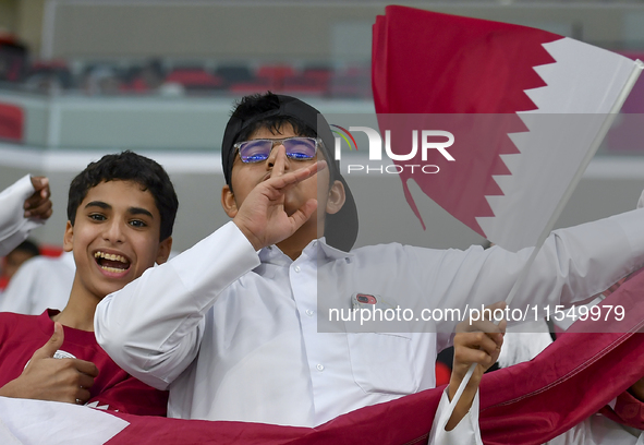 Qatar team supporters cheer for their team during the qualification 3rd round for the FIFA World Cup 2026 group A match between Qatar and Un...