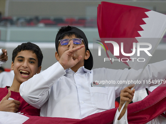 Qatar team supporters cheer for their team during the qualification 3rd round for the FIFA World Cup 2026 group A match between Qatar and Un...