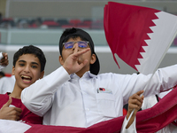 Qatar team supporters cheer for their team during the qualification 3rd round for the FIFA World Cup 2026 group A match between Qatar and Un...