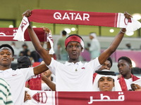 Qatar team supporters cheer for their team during the qualification 3rd round for the FIFA World Cup 2026 group A match between Qatar and Un...