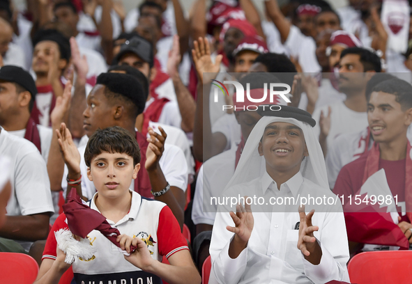 Qatar team supporters cheer for their team during the qualification 3rd round for the FIFA World Cup 2026 group A match between Qatar and Un...