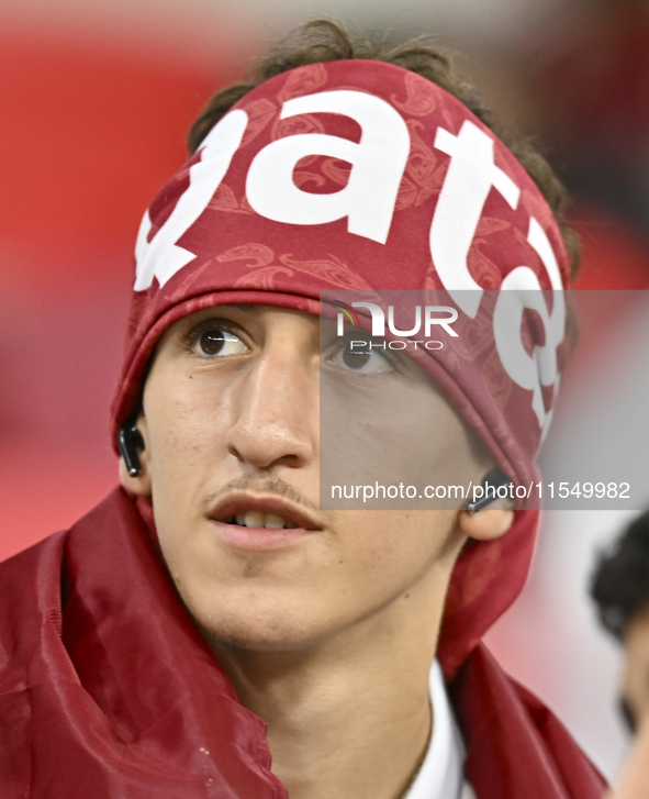 Qatar team supporters cheer for their team during the qualification 3rd round for the FIFA World Cup 2026 group A match between Qatar and Un...