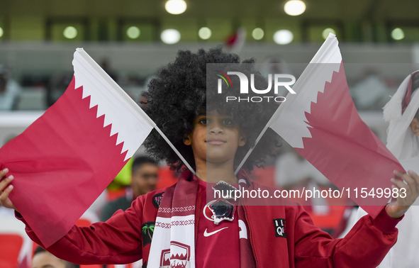 Qatar team supporters cheer for their team during the qualification 3rd round for the FIFA World Cup 2026 group A match between Qatar and Un...