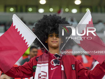 Qatar team supporters cheer for their team during the qualification 3rd round for the FIFA World Cup 2026 group A match between Qatar and Un...