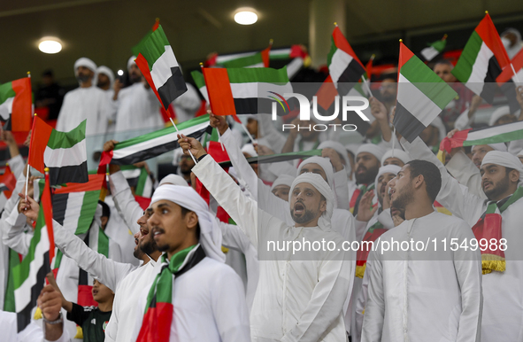 United Arab Emirates team supporters cheer for their team during the qualification 3rd round for the FIFA World Cup 2026 group A match betwe...