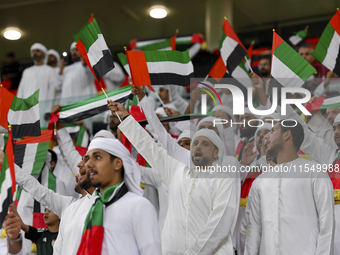 United Arab Emirates team supporters cheer for their team during the qualification 3rd round for the FIFA World Cup 2026 group A match betwe...