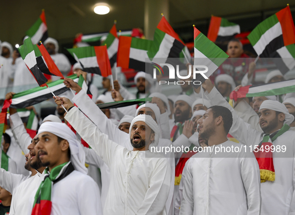 United Arab Emirates team supporters cheer for their team during the qualification 3rd round for the FIFA World Cup 2026 group A match betwe...