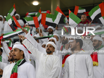 United Arab Emirates team supporters cheer for their team during the qualification 3rd round for the FIFA World Cup 2026 group A match betwe...