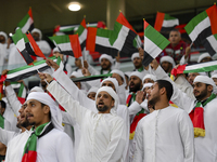 United Arab Emirates team supporters cheer for their team during the qualification 3rd round for the FIFA World Cup 2026 group A match betwe...