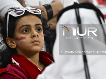 Qatar team supporters cheer for their team during the qualification 3rd round for the FIFA World Cup 2026 group A match between Qatar and Un...