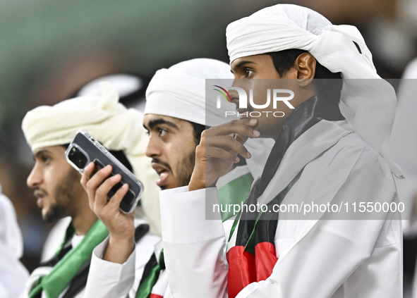 United Arab Emirates team supporters cheer for their team during the qualification 3rd round for the FIFA World Cup 2026 group A match betwe...