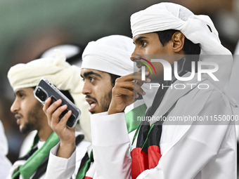 United Arab Emirates team supporters cheer for their team during the qualification 3rd round for the FIFA World Cup 2026 group A match betwe...