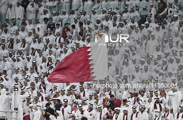 Qatar team supporters cheer for their team during the qualification 3rd round for the FIFA World Cup 2026 group A match between Qatar and Un...