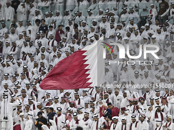 Qatar team supporters cheer for their team during the qualification 3rd round for the FIFA World Cup 2026 group A match between Qatar and Un...