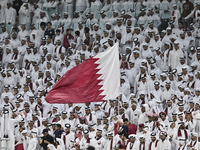 Qatar team supporters cheer for their team during the qualification 3rd round for the FIFA World Cup 2026 group A match between Qatar and Un...