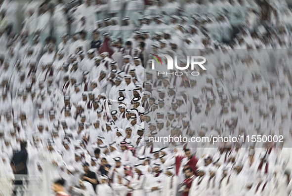 Qatar team supporters cheer for their team during the qualification 3rd round for the FIFA World Cup 2026 group A match between Qatar and Un...