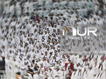 Qatar team supporters cheer for their team during the qualification 3rd round for the FIFA World Cup 2026 group A match between Qatar and Un...