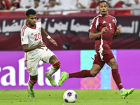 Pedro Correia (R) of Qatar battles for the ball with Yahya Alghassani of the United Arab Emirates during the qualification 3rd round for the...