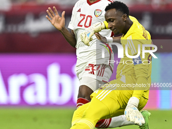 Meshaal Barsham of Qatar battles for the ball with Yahya Alghassani of the United Arab Emirates during the qualification 3rd round for the F...