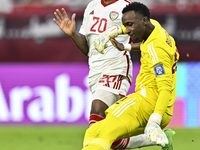 Meshaal Barsham of Qatar battles for the ball with Yahya Alghassani of the United Arab Emirates during the qualification 3rd round for the F...