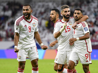 Harib Abdalla (R) of the United Arab Emirates celebrates with his teammate after scoring during the qualification 3rd round for the FIFA Wor...