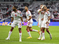 Harib Abdalla (R) of the United Arab Emirates celebrates with his teammate after scoring during the qualification 3rd round for the FIFA Wor...