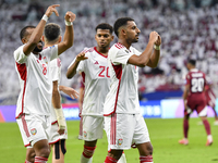 Harib Abdalla (R) of the United Arab Emirates celebrates with his teammate after scoring during the qualification 3rd round for the FIFA Wor...