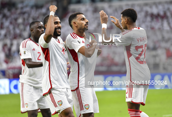 Harib Abdalla (second from right) of the United Arab Emirates celebrates with his teammate after scoring during the qualification third roun...