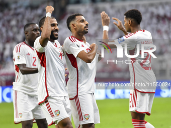 Harib Abdalla (second from right) of the United Arab Emirates celebrates with his teammate after scoring during the qualification third roun...