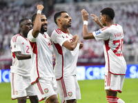 Harib Abdalla (second from right) of the United Arab Emirates celebrates with his teammate after scoring during the qualification third roun...