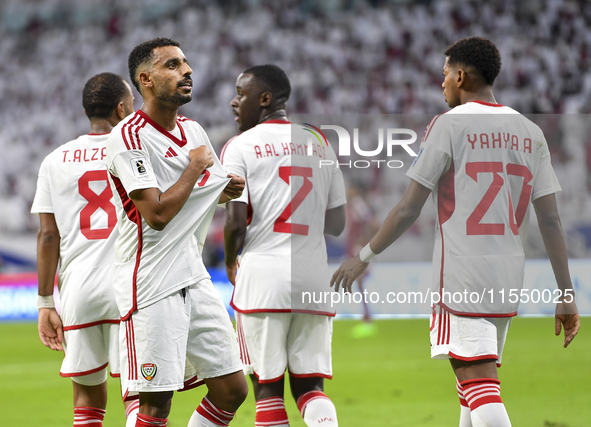 Harib Abdalla (L) of the United Arab Emirates celebrates with his teammate after scoring during the qualification 3rd round for the FIFA Wor...