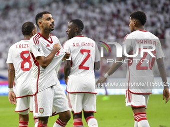 Harib Abdalla (L) of the United Arab Emirates celebrates with his teammate after scoring during the qualification 3rd round for the FIFA Wor...