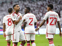 Harib Abdalla (L) of the United Arab Emirates celebrates with his teammate after scoring during the qualification 3rd round for the FIFA Wor...