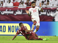 Pedro Correia of Qatar battles for the ball with Yahya Alghassani of the United Arab Emirates during the qualification 3rd round for the FIF...