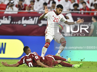 Pedro Correia of Qatar battles for the ball with Yahya Alghassani of the United Arab Emirates during the qualification 3rd round for the FIF...