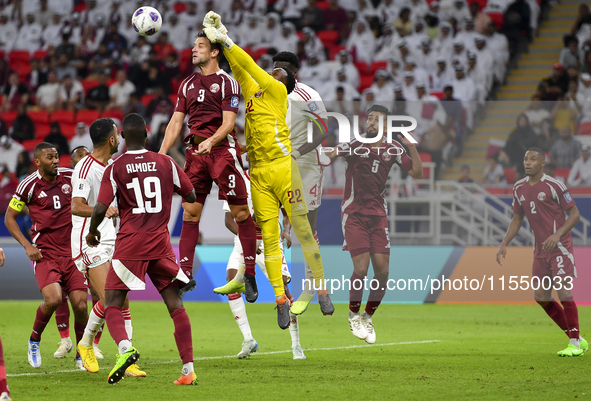 Meshaal Barsham (#22) of Qatar battles for the ball with Kouame Kouadio (#4) of United Arab Emirates during the qualification 3rd round for...