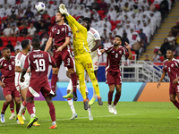 Meshaal Barsham (#22) of Qatar battles for the ball with Kouame Kouadio (#4) of United Arab Emirates during the qualification 3rd round for...