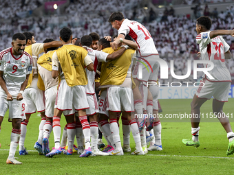 Players of the United Arab Emirates celebrate after scoring a goal during the qualification 3rd round for the FIFA World Cup 2026 group A ma...