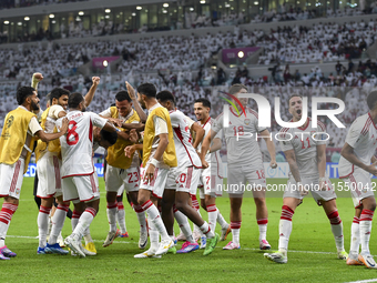 Players of the United Arab Emirates celebrate after scoring a goal during the qualification 3rd round for the FIFA World Cup 2026 group A ma...