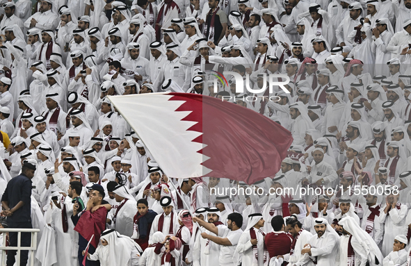 Qatar team supporters cheer for their team during the qualification 3rd round for the FIFA World Cup 2026 group A match between Qatar and Un...