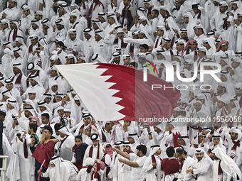 Qatar team supporters cheer for their team during the qualification 3rd round for the FIFA World Cup 2026 group A match between Qatar and Un...