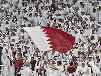 Qatar team supporters cheer for their team during the qualification 3rd round for the FIFA World Cup 2026 group A match between Qatar and Un...