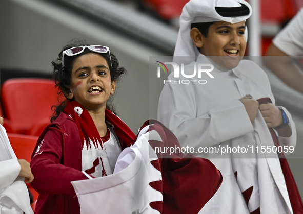 Qatar team supporters cheer for their team during the qualification 3rd round for the FIFA World Cup 2026 group A match between Qatar and Un...