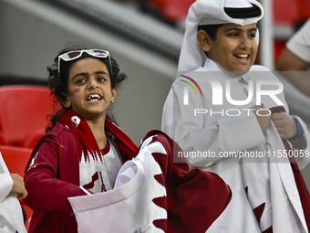 Qatar team supporters cheer for their team during the qualification 3rd round for the FIFA World Cup 2026 group A match between Qatar and Un...