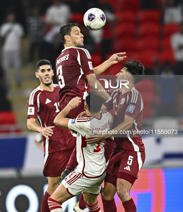 Lucas Mendes of Qatar battles for the ball with Caio Correa of the United Arab Emirates during the qualification 3rd round for the FIFA Worl...