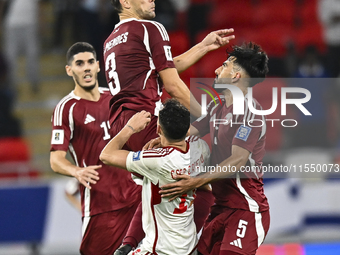 Lucas Mendes of Qatar battles for the ball with Caio Correa of the United Arab Emirates during the qualification 3rd round for the FIFA Worl...