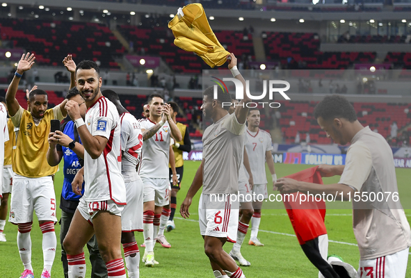 Players from the United Arab Emirates celebrate their victory in the qualification 3rd round for the FIFA World Cup 2026 group A match betwe...